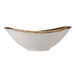 A Tuxton TuxTrendz Capistrano bowl with white and brown speckles and a gold rim.