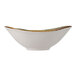 A white Tuxton China bowl with a brown rim.