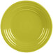 A close-up of a yellow Fiesta luncheon plate with a circular pattern.