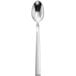 A silver spoon with a white handle.