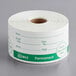 A roll of white paper labels with permanent green text that says "Day of the Week" for Noble Products.
