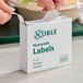 A box of Noble 1" x 2" removable hospital labels containing 500 labels per roll.