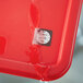 A red plastic container with a Noble Products Dissolvable Clock label on it.
