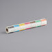 A roll of white paper with colorful Noble Products dissolvable day of the week labels.