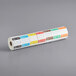 A roll of Noble Products Thursday food labeling stickers with colorful labels.