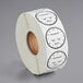 A roll of white paper with black and white labels that say "Permanent Clock Label"
