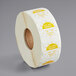 A roll of white paper with yellow and white labels reading "Tuesday"
