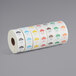 A white roll of Noble Products food labeling stickers with different colored Day of the Week labels.