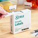 A box of Noble 1" x 2" removable food rotation labels containing 500 labels per roll.