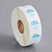 A roll of white paper with blue and white Noble Products labels with a blue circle.