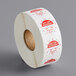 A roll of white stickers with red writing that says "Wednesday" and "Permanent" on them.