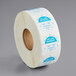 A roll of white paper with blue and white text reading "Monday" and "1" Day of the Week Clock Label"