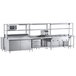 A Chef's Counter serving line with a sandwich prep table, steam table, and work table.