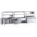 A stainless steel Chef's Counter serving line with a sandwich prep table, steam table, and dish cabinets.