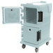 A slate blue Cambro Ultra Camcart for food pans with a door open.