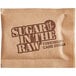A brown Sugar In The Raw packet with text on it.