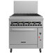 A large stainless steel Vulcan gas range with a charbroiler and convection oven.