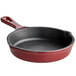 A Valor merlot enameled cast iron skillet with a handle.