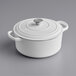 A Valor Arctic White enameled cast iron pot with a lid.