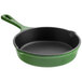 A Valor fern green enameled cast iron skillet with a black handle.