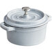 A white Valor enameled cast iron pot with a lid.