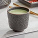 Acopa Heika 5 oz. Black Matte Textured Stoneware Tea Cup - 12/Case Main Thumbnail 1