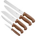A group of Choice knives with brown handles.