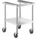 A stainless steel metal cart with black wheels.