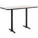 A white rectangular cafe table with black edges and black legs.