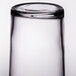 A close up of a Libbey straight sided glass with a white background.