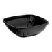 A Visions black PET plastic square bowl with a curved edge on a white background.