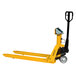 A yellow Wesco battery powered pallet truck with black wheels and a Mettler Toledo Hawk digital display.