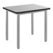 A National Public Seating utility table with a gray laminate top and metal legs.