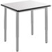 A white square table with metal legs.