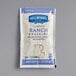 A small white and blue Hellmann's Ranch dressing packet.