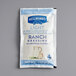 A white package with blue text and a picture of Hellmann's Light Ranch dressing.