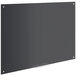 A Dynamic by 360 Office Furniture black glass dry erase board with metal corners.