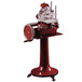 A red and white Omas Volano pedestal stand for a manual slicer with a red wheel.