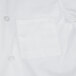 A white Chef Revival chef coat with a white pocket.