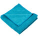 A folded blue Unger SmartColor microfiber cleaning cloth.