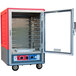 A red and grey Metro C5 heated holding and proofing cabinet with a clear door open.