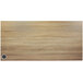 A BFM Seating Sawmill Oak rectangular wood table top with a round hole in the middle.