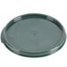 A Carlisle green plastic lid with a handle.