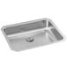 A stainless steel Elkay single bowl sink with a drain.