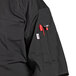 A black Uncommon Chef Delray Pro Vent chef coat with a mesh back and a pocket.