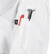 A close up of the pocket on a white Uncommon Chef Tempest Pro Vent long sleeve chef coat.