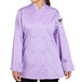 A woman wearing a lilac Uncommon Chef Tempest Pro Vent long sleeve chef coat.