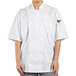 A woman wearing a white Uncommon Chef Aruba Pro chef coat with mesh back.