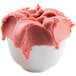 A bowl of pink Fabbri Morbifrutta gelato on a white background.