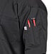 A close up of the pocket on a black Uncommon Chef Montego Pro Vent chef coat.